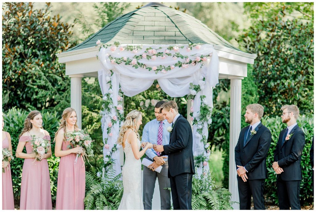 Bride and Groom exchange rings during their Ceremony held at The Venetian Estate, formerly known as Maylon House, in Milton, WV