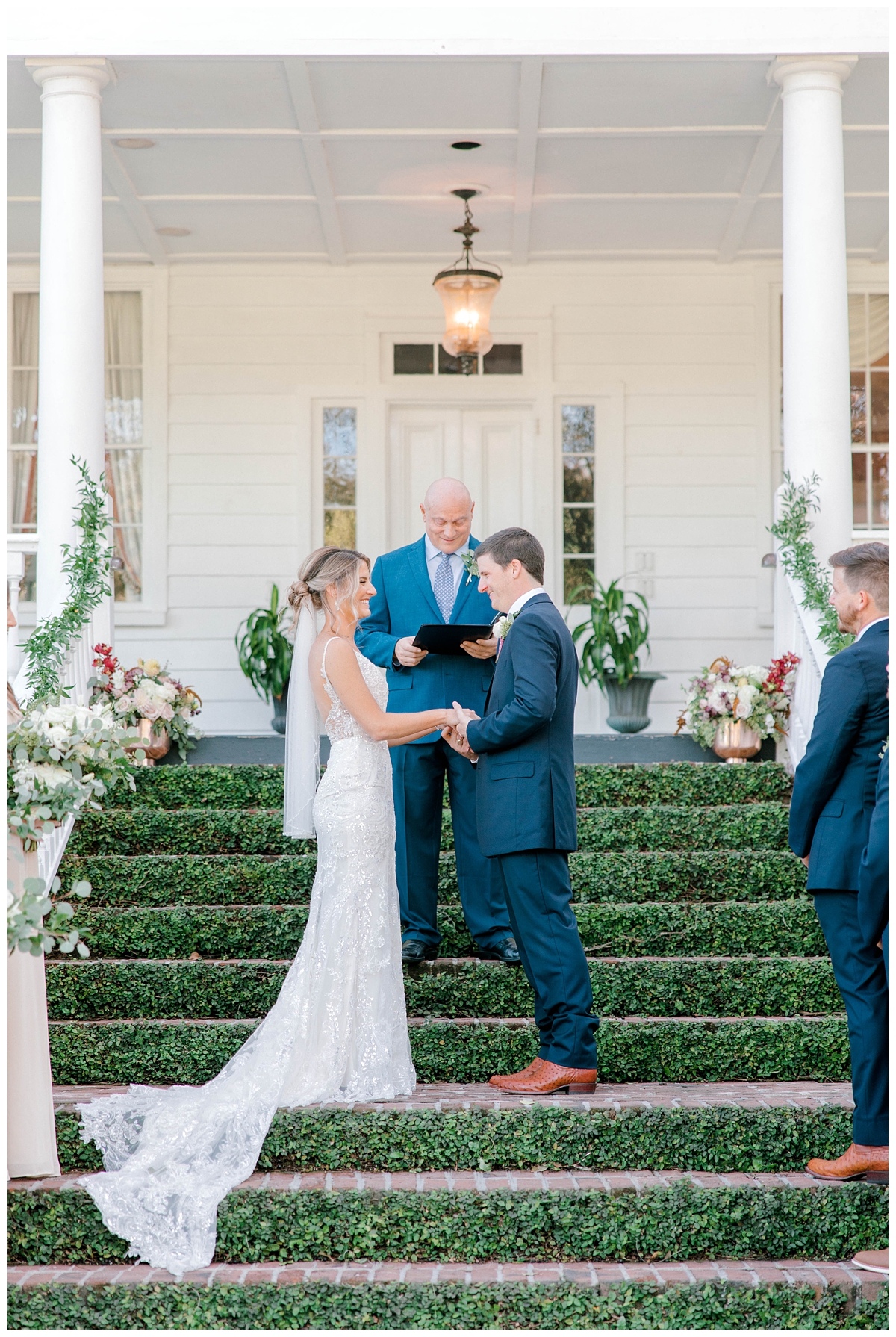 Bride and Groom hold hands during ceremony at Old Wide Awake outside charleston, SC