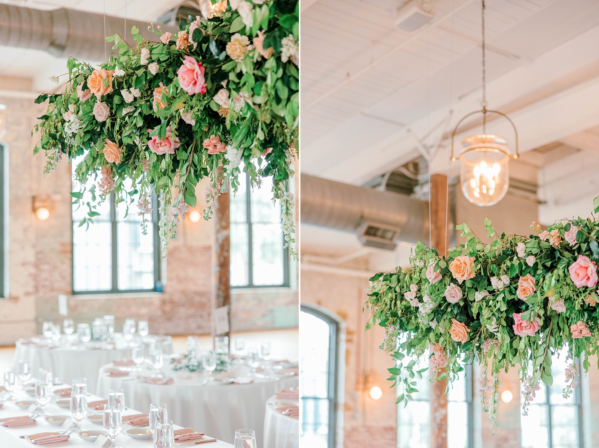 wedding reception inside The Cedar Room with hanging floral arrangement of pink and peach roses 
