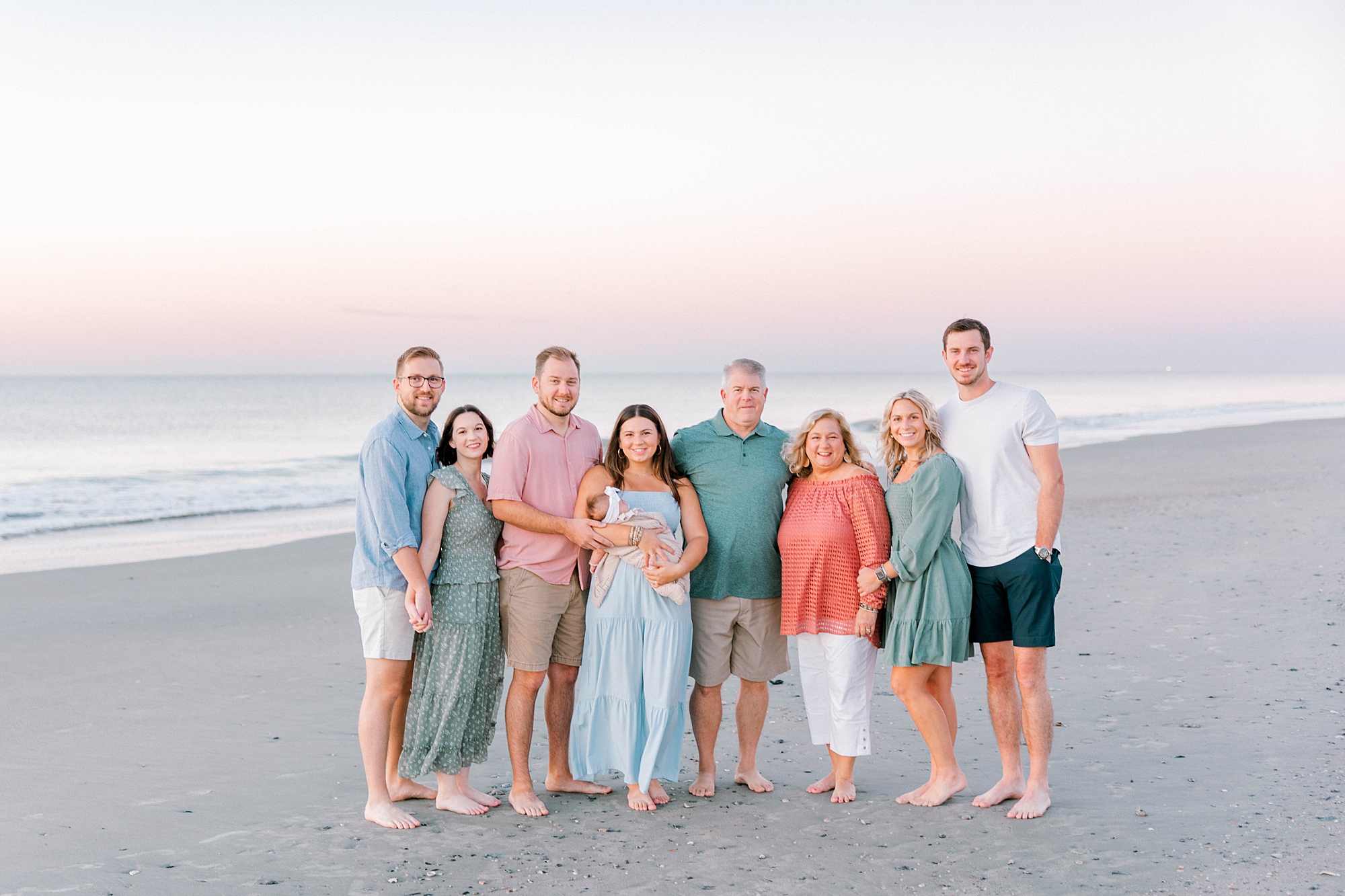 Charleston beach family photos with cotton candy skies at sunset