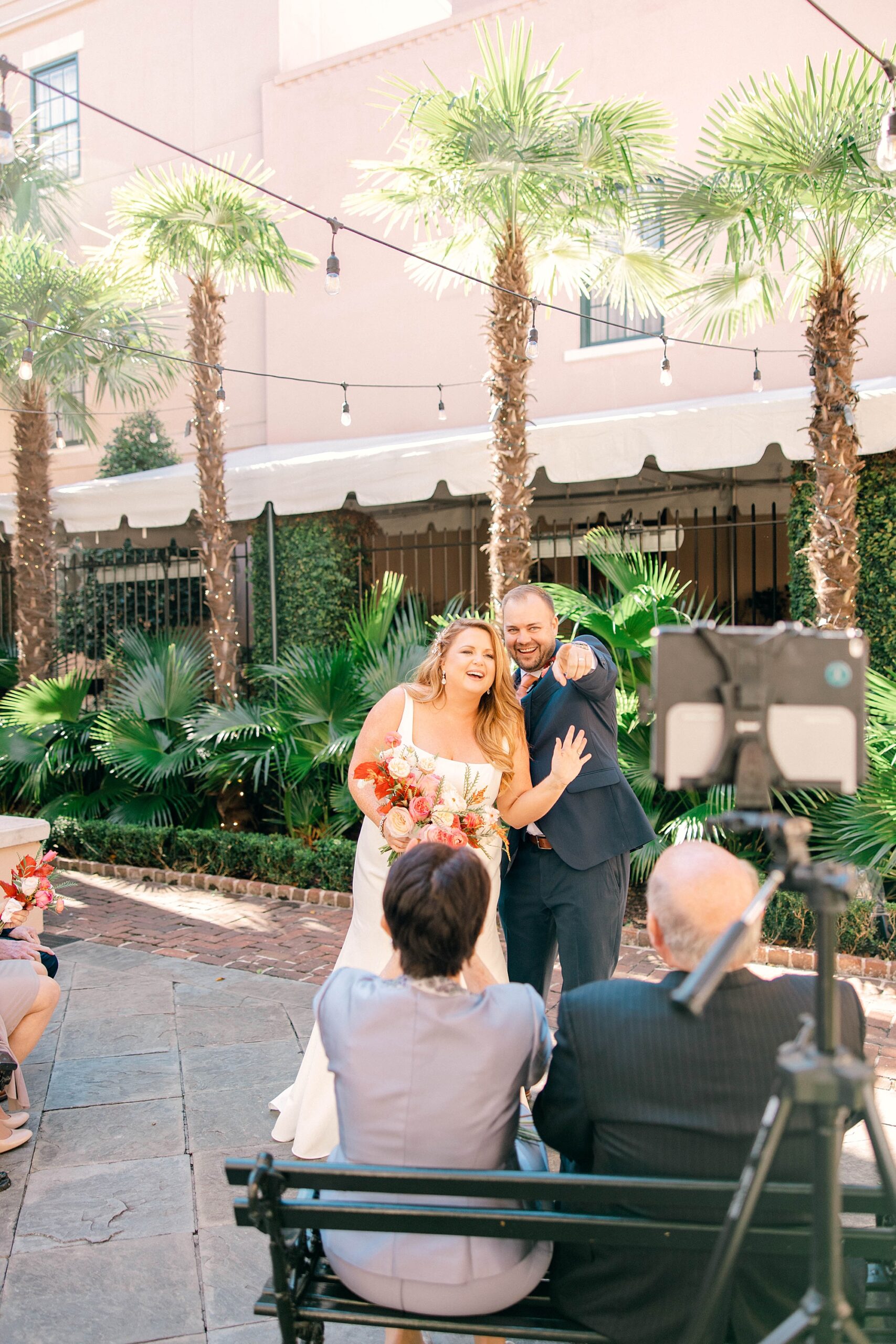 newlyweds show off rings to parents during intimate Planter's Inn wedding ceremony 