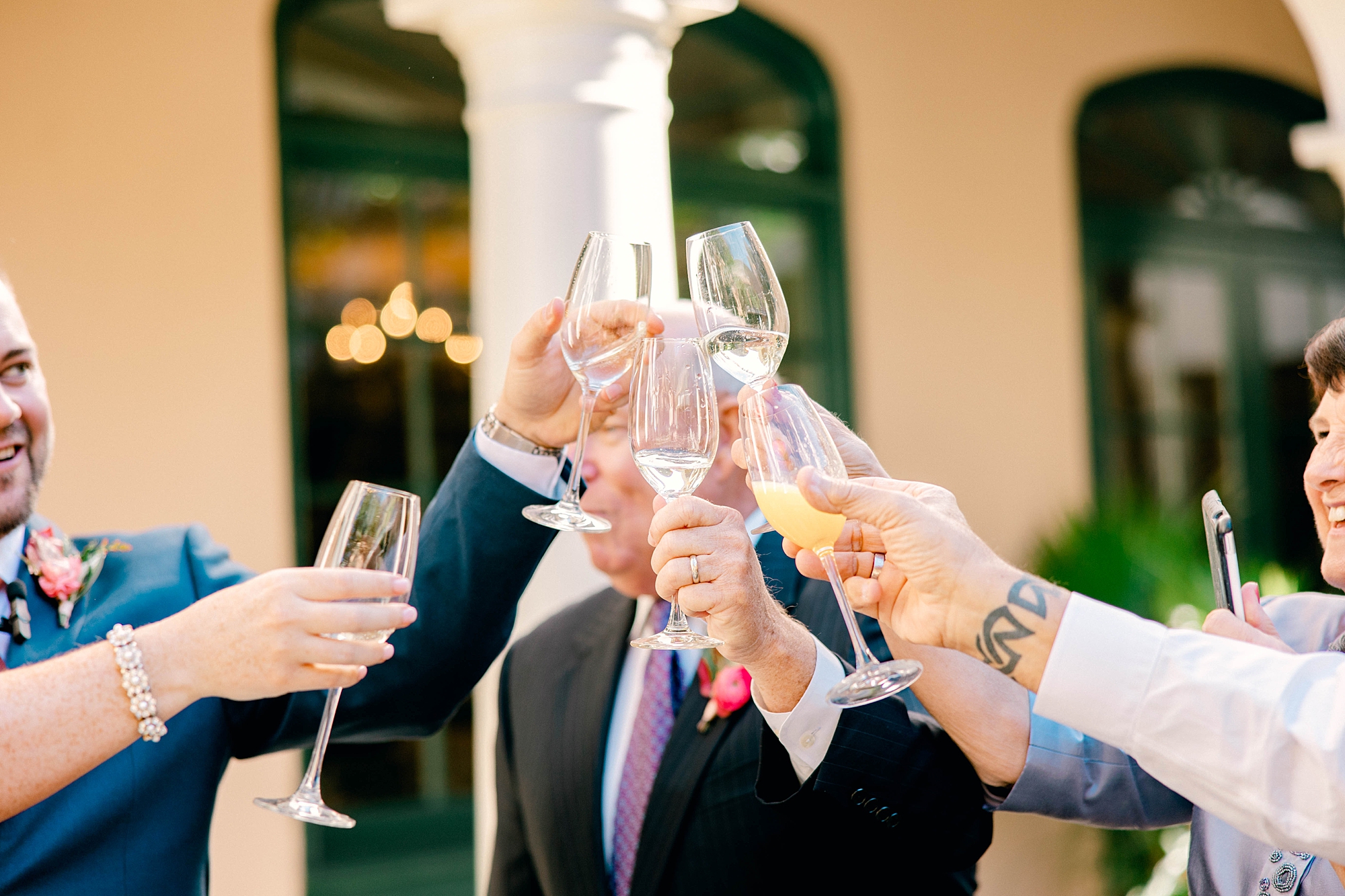 bride and groom toast with parents during intimate Planter's Inn wedding day