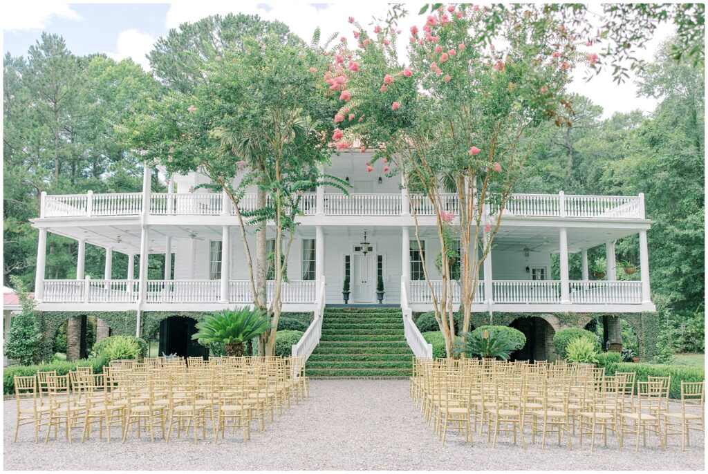 ceremony site at Old Wide Awake in front of the grand, ivy adorned staircase of a beautiful historic home with grand piazzas and white collumns