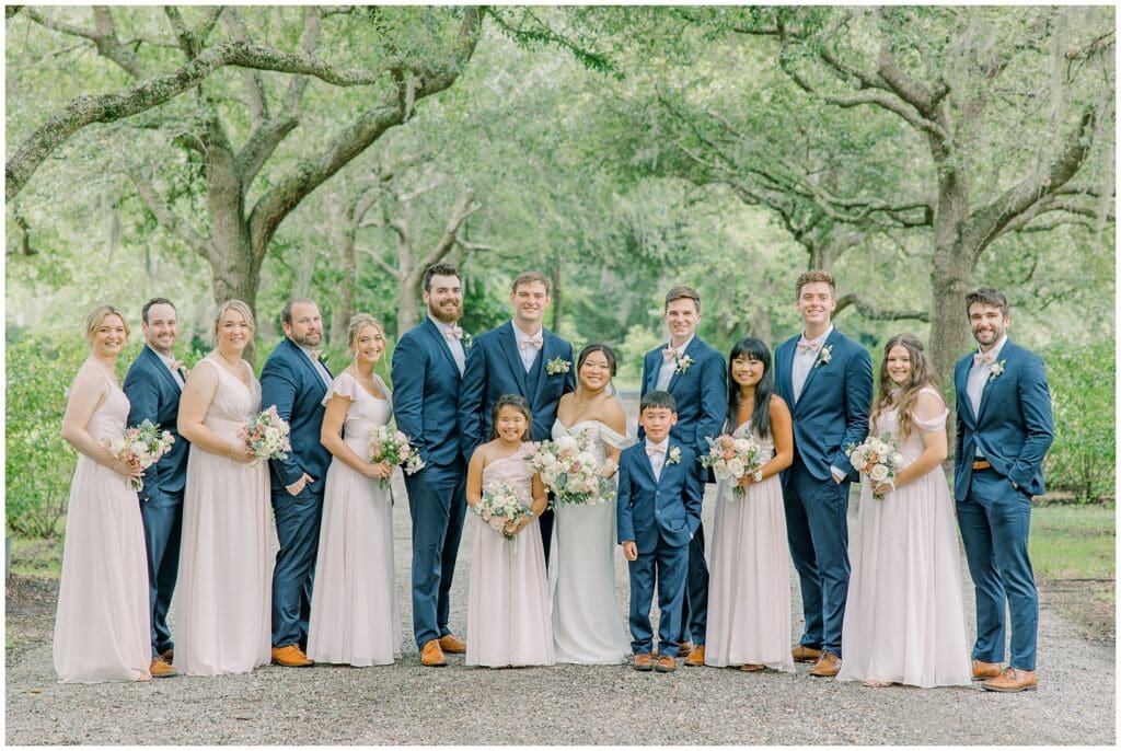 Wedding Party Portraits beneath an angel oak alley at an Old Wide Awake summer wedding in Charleston, SC